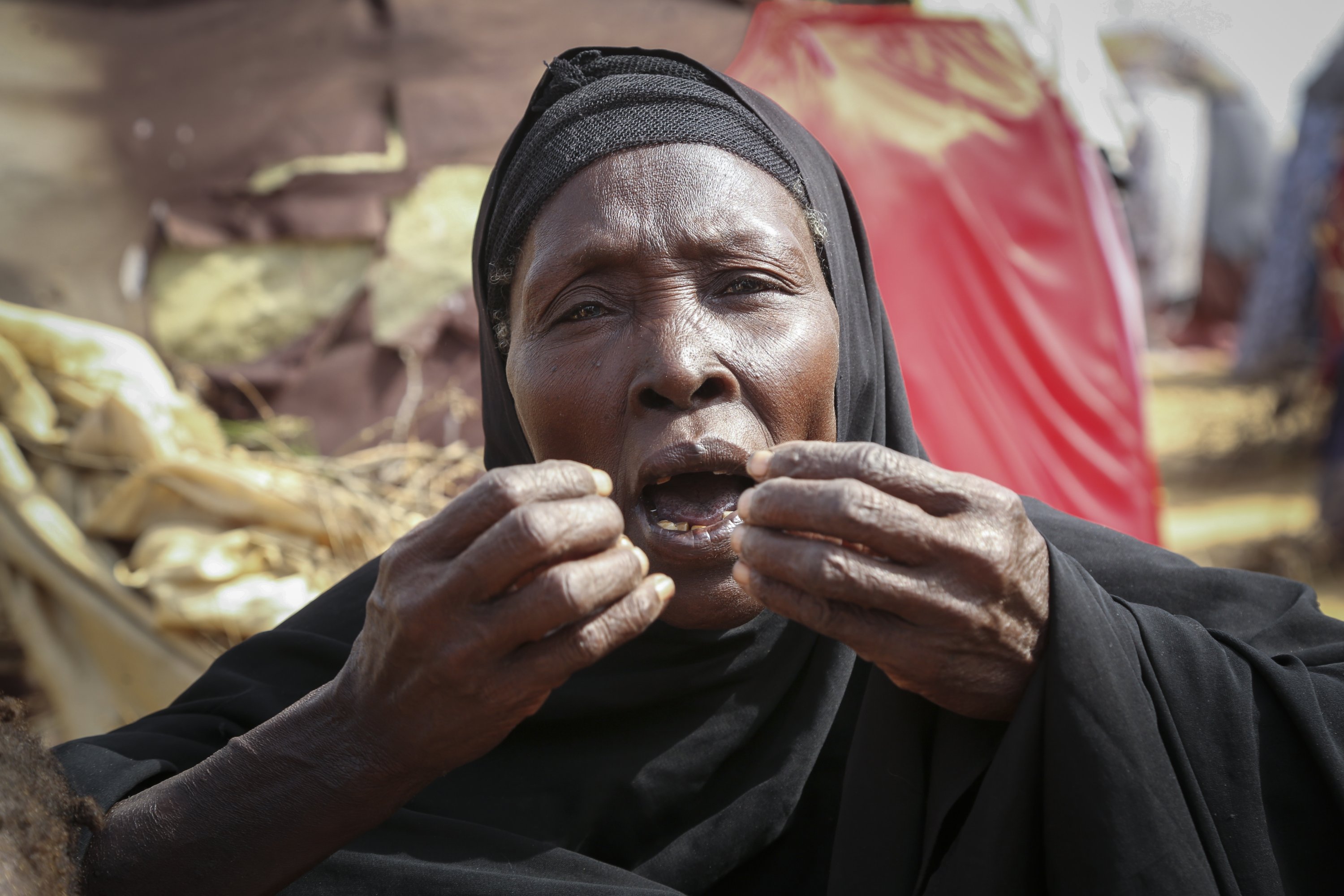 Dhahabo Isse, 60, describes how she fled from the drought without food or water causing four of her children to die of hunger, Mogadishu, Somalia, June 30, 2022. (AP Photo)