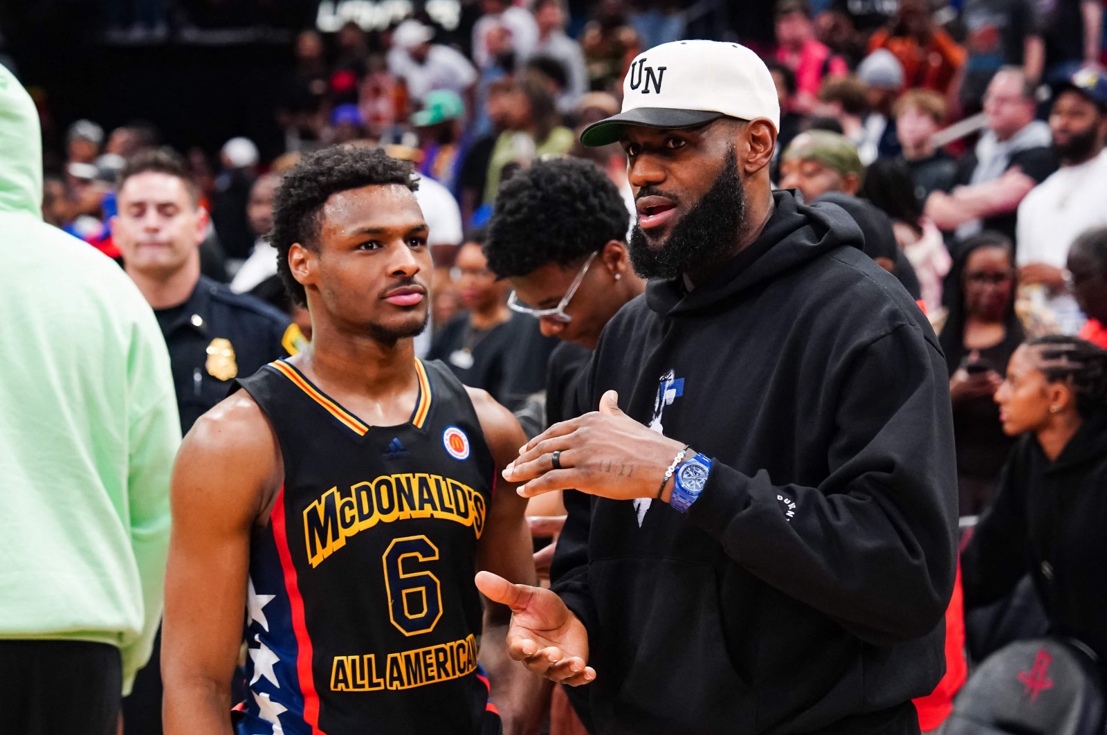 West team&#039;s Bronny James (L) talks to to LeBron James, of the Los Angeles Lakers, after the 2023 McDonald&#039;s High School Boys All-American Game at Toyota Center, Texas, U.S., March 28, 2023. (AFP Photo)