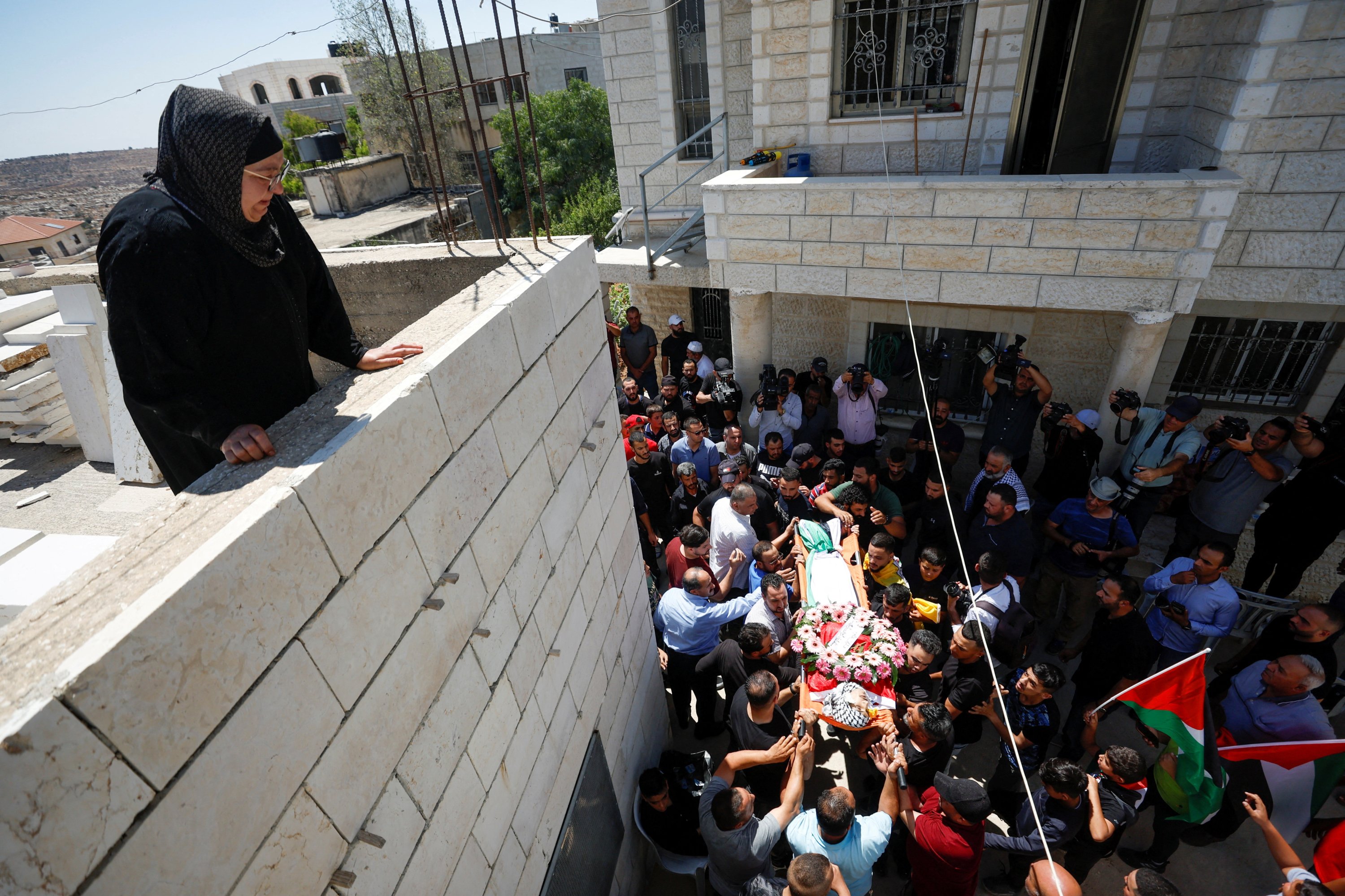 Mourners carry the body of a Palestinian who was killed by Israeli settlers, Israeli-occupied West Bank, Palestine, Aug. 5, 2023. (Reuters Photo)