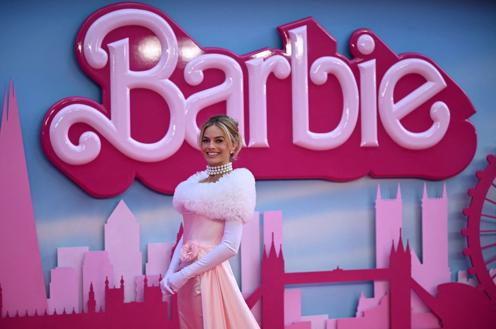 Australian actress Margot Robbie poses on the pink carpet upon arrival for the European premiere of &quot;Barbie&quot; in central London, U.K., July 12, 2023. (AFP Photo)
