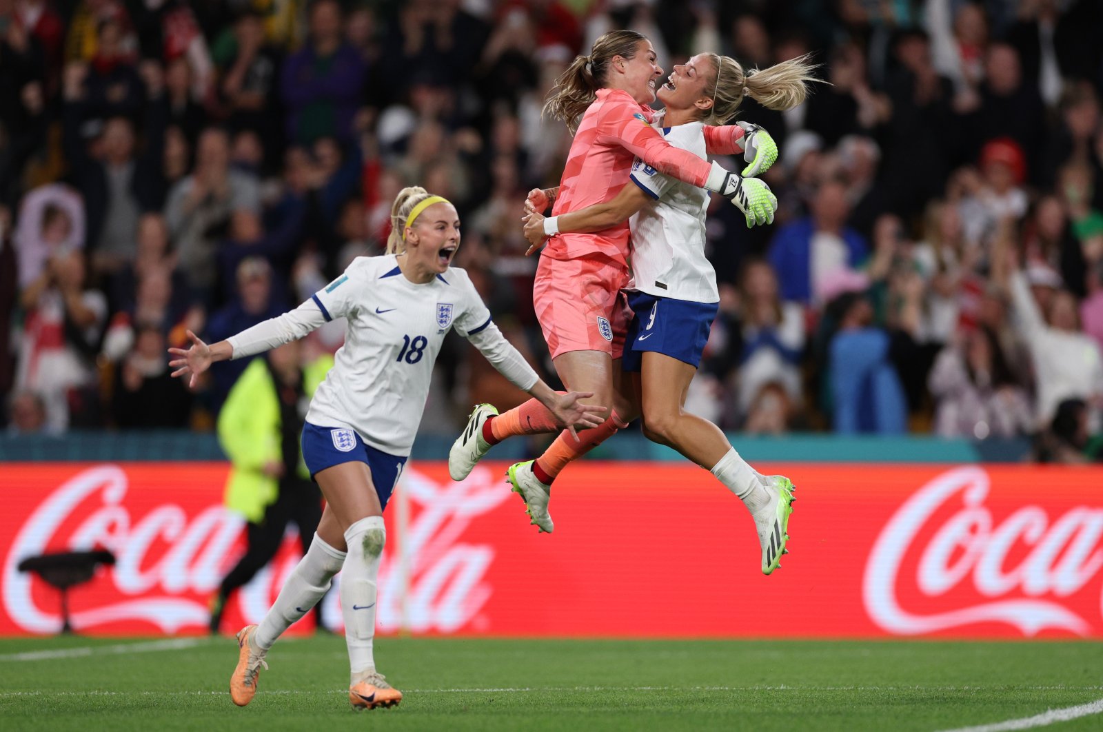 England&#039;s Chloe Kelly (L) celebrates with teammates Rachel Daly and Mary Earps after scoring her team&#039;s fifth and winning penalty in the penalty shootout during the Women&#039;s World Cup round of 16 match against Nigeria at Brisbane Stadium, Brisbane, Australia, Aug. 7, 2023. (Getty Images Photo)